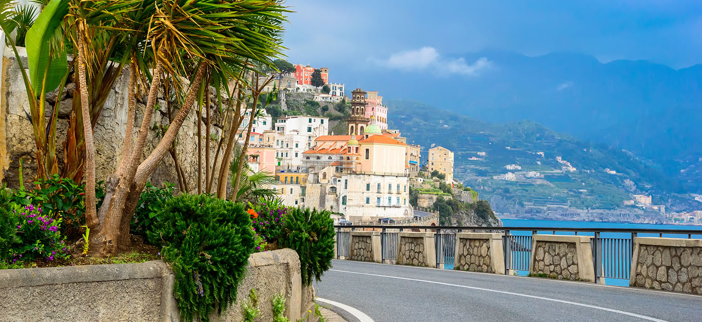 Europe is home to some of the world’s most picturesque landscapes, and there's no better way to explore its stunning beauty than by hitting the open road. From sweeping coastal views to winding mountain paths, here are the most scenic road trips in Europe that you need to take for a truly unforgettable adventure. 1. The Amalfi Coast, Italy Why It’s Scenic: The Amalfi Coast is one of the most famous and scenic coastal drives in the world. Stretching along the southern edge of Italy’s Sorrentine Peninsula, this 50-kilometer route offers dramatic cliffside views, Mediterranean waters, and charming villages perched on the hills. The road twists and turns, offering vistas of lush landscapes, historic towns, and beautiful beaches. The route connects popular towns like Positano, Ravello, and Amalfi, all of which are rich in history and culture. Highlights: Positano's colorful cliffside houses Ravello’s stunning gardens and views Amalfi’s cathedral and beaches Delicious local Italian cuisine at seaside restaurants 2. The Romantic Road, Germany Why It’s Scenic: The Romantic Road (Romantische Straße) takes you through some of Germany’s most enchanting medieval towns and fairytale castles. Spanning 350 kilometers from Würzburg in the north to Füssen in the south, this route passes through forests, hills, and vineyards. It’s perfect for those seeking a blend of natural beauty and historical charm. The quaint towns and castles along the way look like they’ve been lifted straight from a storybook. Highlights: Neuschwanstein Castle (the inspiration for Disney’s Sleeping Beauty Castle) The medieval town of Rothenburg ob der Tauber Picturesque villages like Dinkelsbühl and Nördlingen The charming Würzburg Residence 3. The North Coast 500, Scotland Why It’s Scenic: The North Coast 500 (NC500) is a 500-mile route around the northern coast of Scotland, often referred to as Scotland’s answer to Route 66. The journey takes you through rugged landscapes, remote beaches, and stunning mountain views, all while showcasing the unspoiled natural beauty of the Scottish Highlands. Along the way, you’ll pass castles, quaint fishing villages, and picturesque lochs, offering a taste of Scotland’s rich heritage and diverse landscapes. Highlights: Inverness, the gateway to the Highlands The dramatic cliffs and beaches of Durness Dunrobin Castle and its stunning gardens The Fairy Glen and the Isle of Skye 4. The Trollstigen Road, Norway Why It’s Scenic: Trollstigen (the Troll’s Ladder) is one of the most iconic and scenic routes in Norway. This serpentine mountain road, with its 11 hairpin bends, takes you through the heart of the Norwegian Fjords. The road rises steeply up the mountain, offering breathtaking views of the surrounding waterfalls, valleys, and the deep, blue waters of the fjords. It’s a drive for those who love adventure, as the road climbs to an altitude of 850 meters above sea level. Highlights: The stunning view from the Trollstigen Plateau Geirangerfjord, one of Norway’s most beautiful fjords The winding road itself with dramatic landscapes The nearby Åndalsnes town and hiking trails 5. The Pyrenees, France and Spain Why It’s Scenic: The Pyrenees mountain range forms a natural border between France and Spain, offering one of the most dramatic and scenic road trip experiences in Europe. The route through the Pyrenees takes you through lush valleys, towering peaks, and picturesque villages, with plenty of opportunities for hiking, cycling, and exploring the vibrant culture of both countries. Whether you’re driving through the French side or the Spanish side, the Pyrenees offer a striking landscape and a rich cultural experience. Highlights: The charming village of Lourdes in France The Spanish town of Jaca and its ancient fortress Stunning mountain vistas and alpine meadows Col du Tourmalet, one of the most famous climbs in the Tour de France 6. The Iceland Ring Road, Iceland Why It’s Scenic: The Iceland Ring Road (Route 1) is a 1,332-kilometer route that circles the entire island, offering a diverse and spectacular array of landscapes. From glaciers and volcanoes to black sand beaches and geothermal springs, this road trip takes you through some of the most unique natural wonders on Earth. The road is accessible year-round, but winter offers a chance to see the Northern Lights while summer brings the Midnight Sun. Highlights: The Golden Circle with geysers, waterfalls, and Thingvellir National Park The Jokulsarlon Glacier Lagoon and Diamond Beach The stunning Seljalandsfoss and Skogafoss waterfalls The volcanic landscapes of Lake Myvatn 7. The Atlantic Road, Norway Why It’s Scenic: The Atlantic Road is a spectacular coastal route in Norway, stretching for 8.3 kilometers and connecting a series of islands via bridges. This unique drive offers dramatic views of the Norwegian Sea, with ocean waves crashing against rocky shores and picturesque lighthouses scattered along the coast. It’s often considered one of the most scenic drives in the world, with an otherworldly landscape that changes with the weather and light. Highlights: The famous Storseisundet Bridge, known for its stunning curvature Views of the remote islands and the vast ocean The town of Kristiansund, located at the northern end of the route Nearby coastal villages with seafood delicacies 8. The Via Aurelia, Italy Why It’s Scenic: For those seeking a blend of history and stunning coastal views, the Via Aurelia is a historic route that stretches from Rome to the French border. The road follows the Tyrrhenian Sea, passing through charming seaside towns, vineyards, and ancient Roman ruins. It’s a slower, more relaxed drive that offers the chance to experience both the Italian coast and its rich history. Highlights: The beautiful beaches of the Ligurian coast The ancient Roman town of Ostia Antica The historic coastal town of Cinque Terre Magnificent views of the Mediterranean Sea Conclusion Whether you’re looking for dramatic mountains, serene coastlines, or charming medieval towns, Europe offers some of the best scenic road trips in the world. These routes provide more than just a journey—they are an experience, allowing you to immerse yourself in nature, culture, and history. So, pack your bags, hit the road, and get ready to create unforgettable memories as you explore some of the most stunning destinations in Europe.